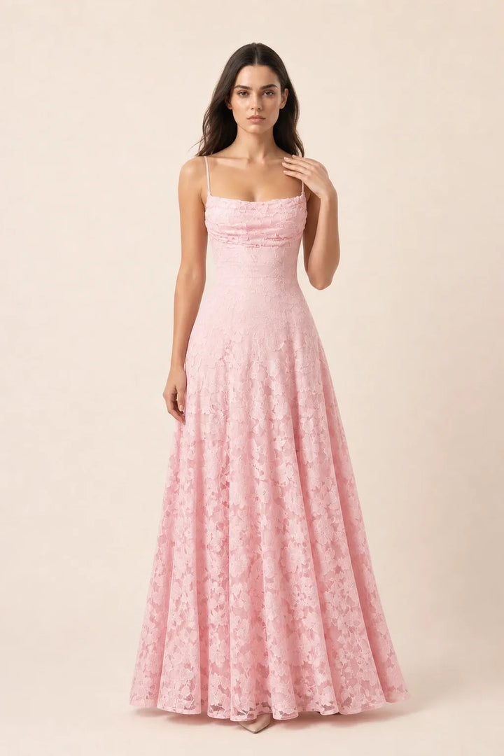 Pink lace appliqué gown on model in contrapposto stance