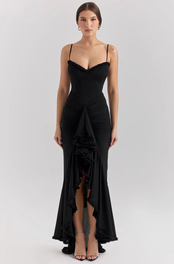 Close-up detail of a black ruffle slit maxi dress showing tiered ruffle layers