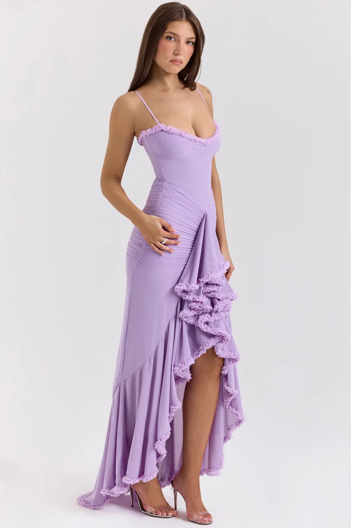 Model wearing a yellow ruffle slit maxi dress, upper body and waist detail