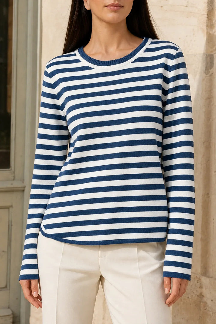 Blue striped long sleeve top on model in contrapposto stance