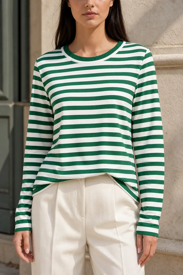 Green striped long sleeve top on model in contrapposto stance
