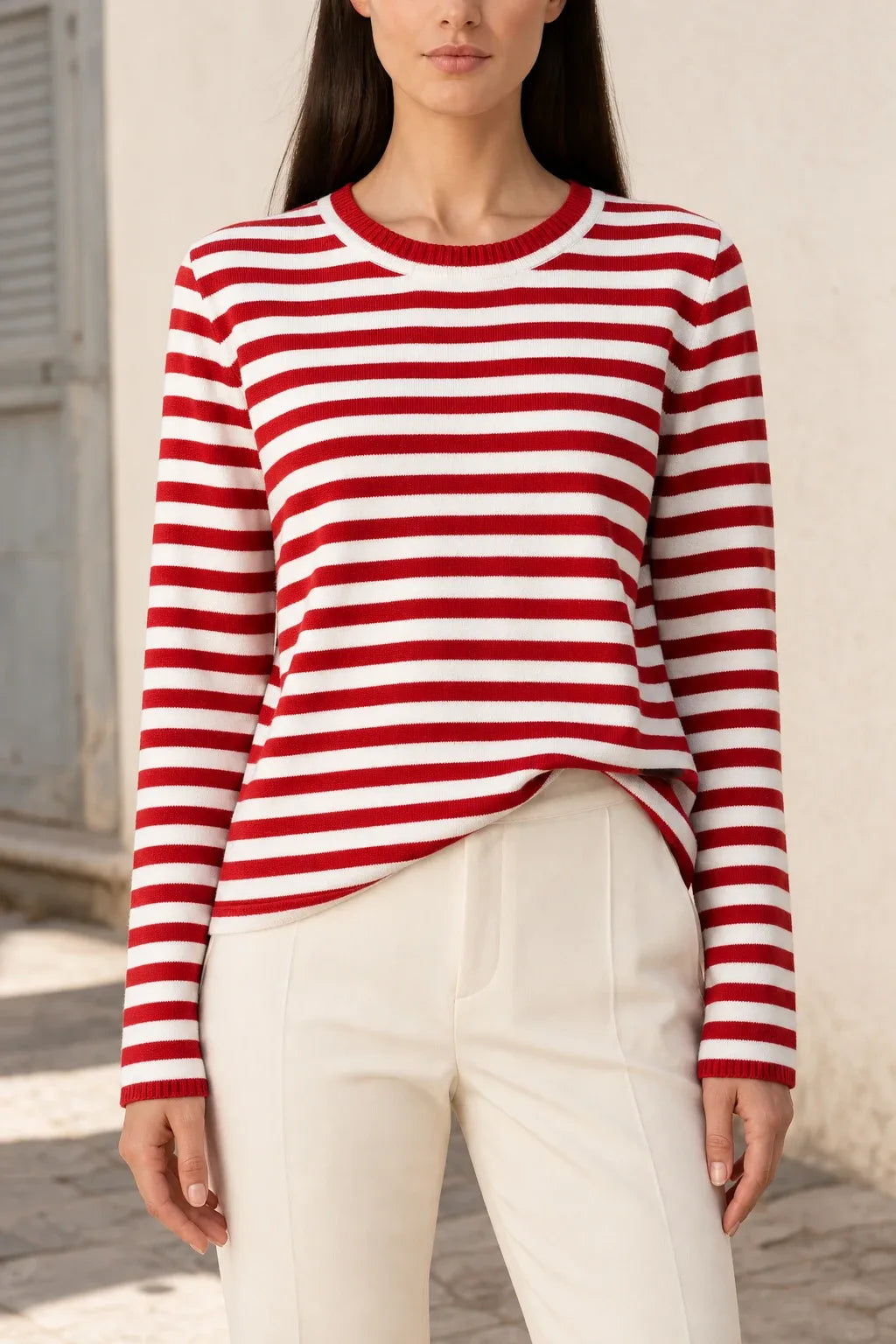Red striped long sleeve top on model in contrapposto stance