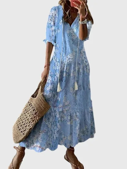 Light blue ikat print midi dress on model, showcasing the all-over print and relaxed midi length