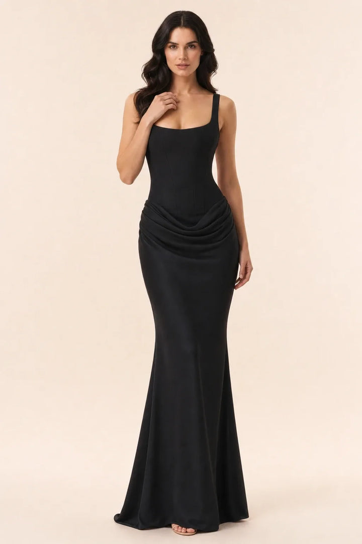Black corset draped gown on a model in a contrapposto stance