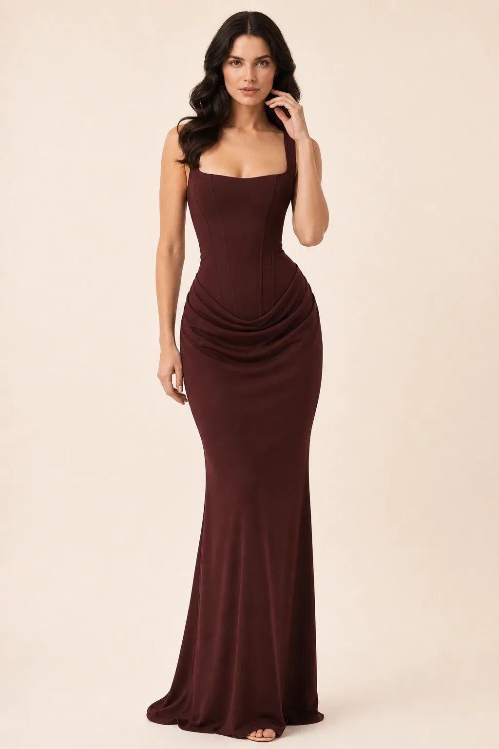 Brown corset draped gown on a model in a contrapposto stance