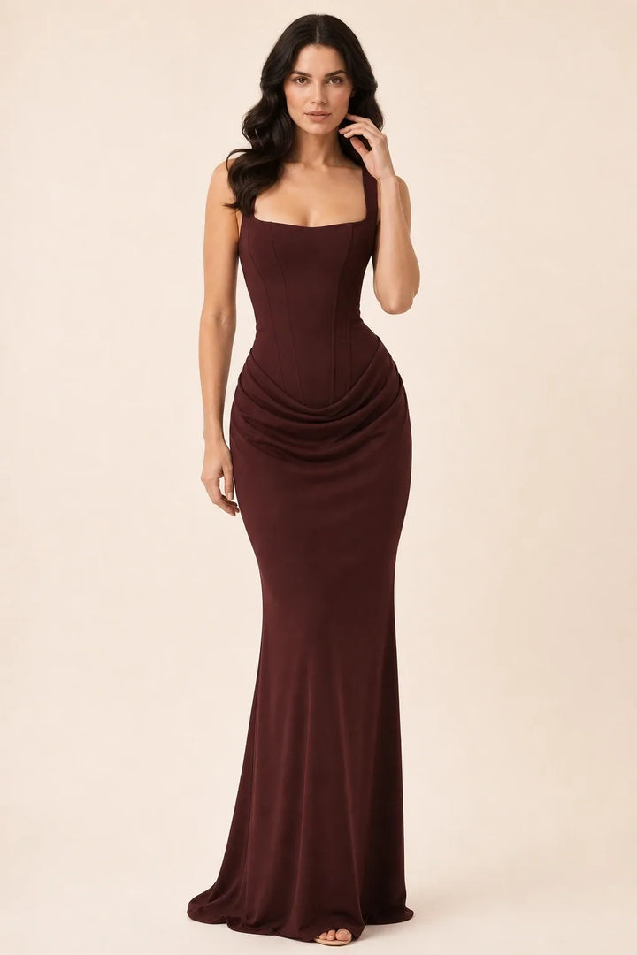 Brown corset draped gown on a model in a contrapposto stance