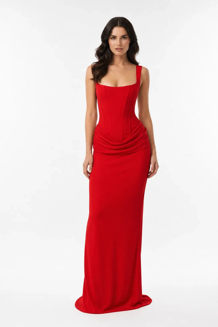 Red corset draped gown on a model in a contrapposto stance