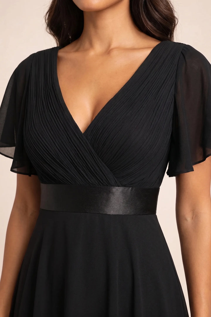 Close-up detail of black flutter sleeve maxi dress fabric and sleeves