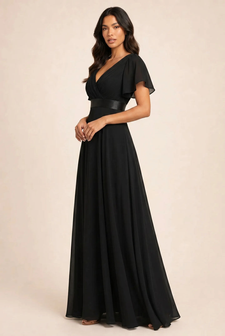 Black flutter sleeve maxi dress on model in three-quarter turn