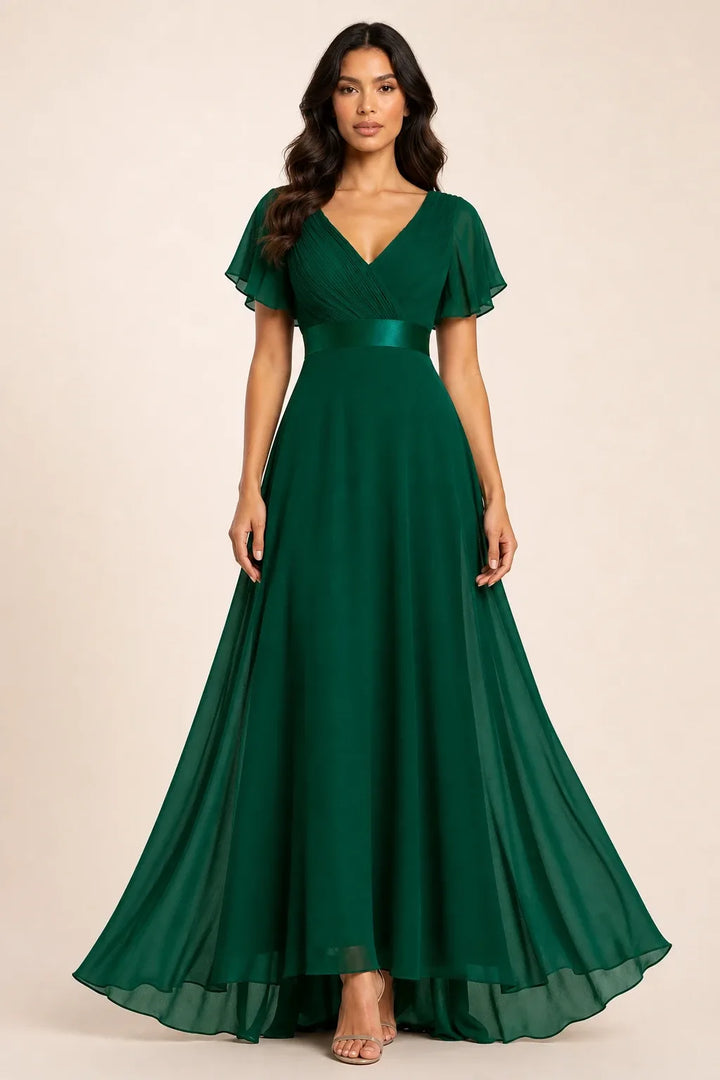 Dark green flutter sleeve maxi dress on model in contrapposto stance