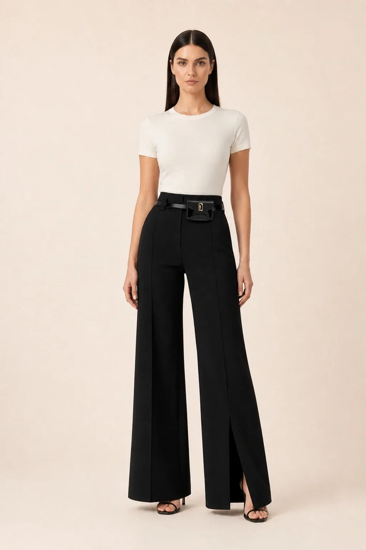Black wide leg pants with split hem, model in contrapposto stance