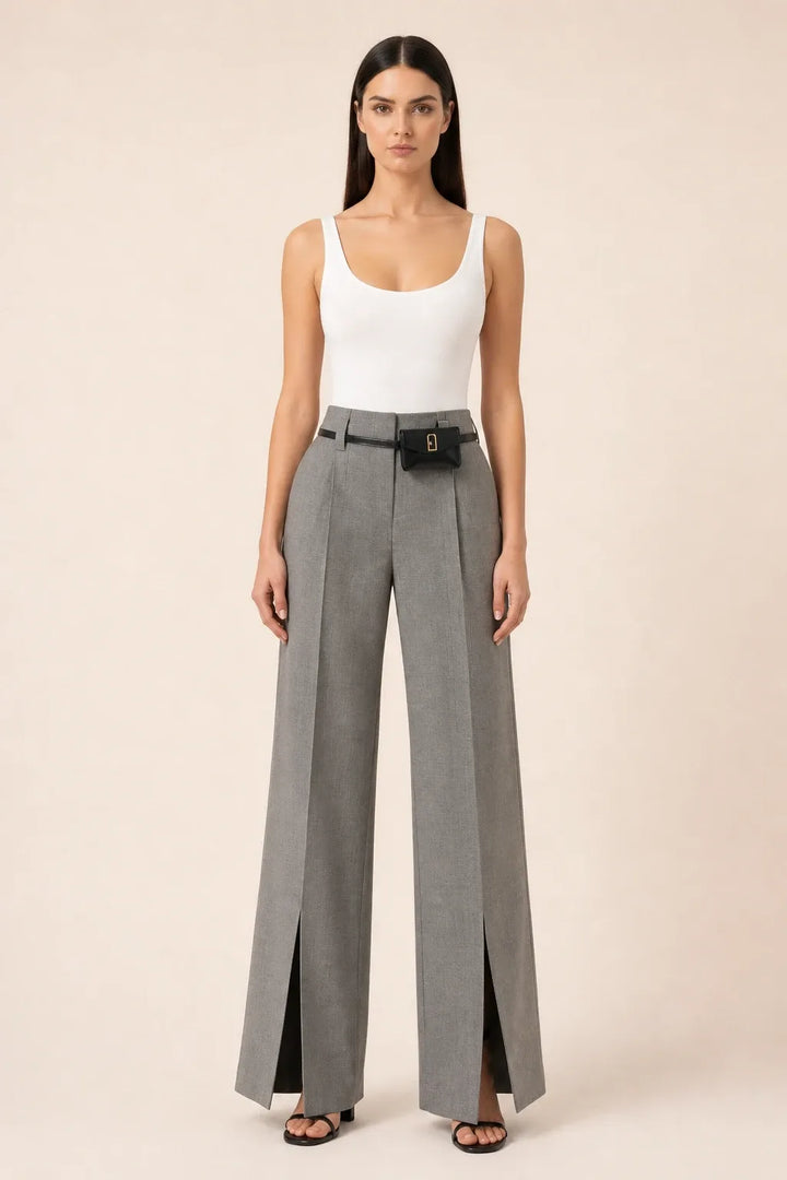 Grey wide leg pants with split hem, model in contrapposto stance