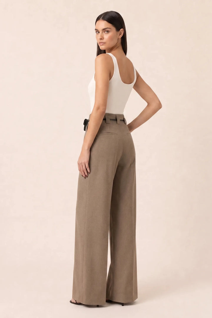 Khaki wide leg pants with split hem, model in three-quarter turn