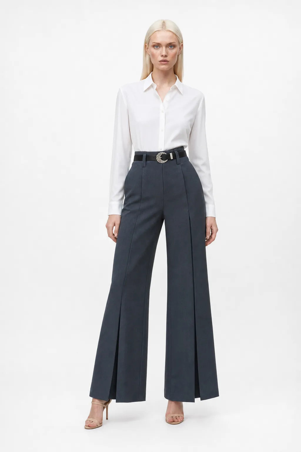 Dark grey wide leg trousers with split hem, model in contrapposto stance