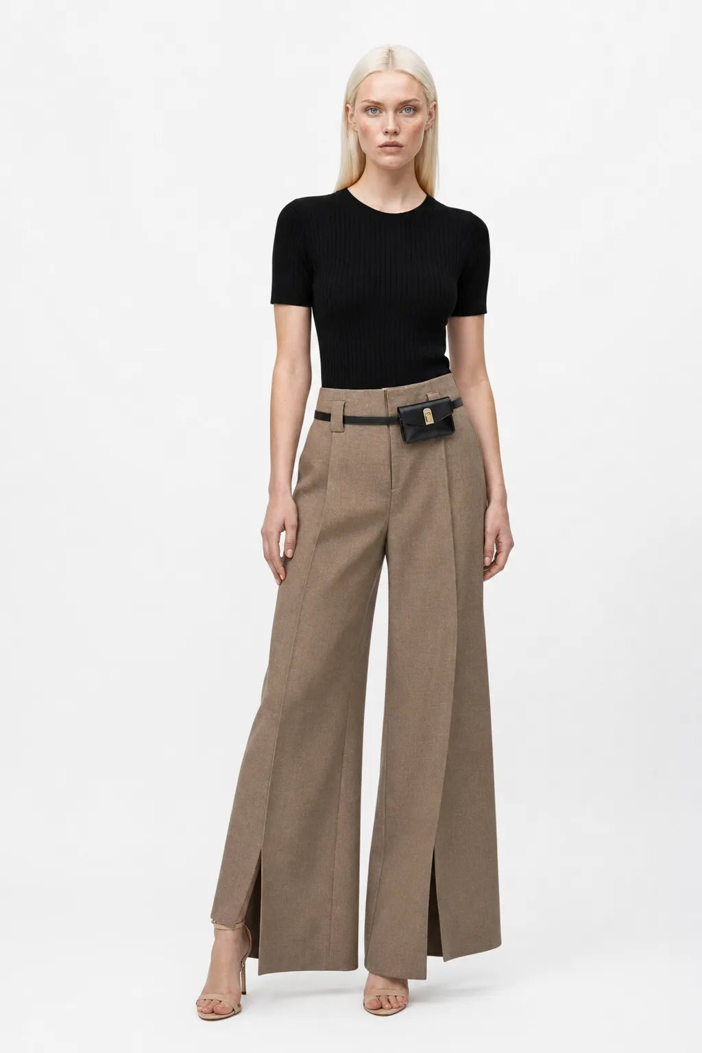 Khaki wide leg trousers with split hem, model in contrapposto stance