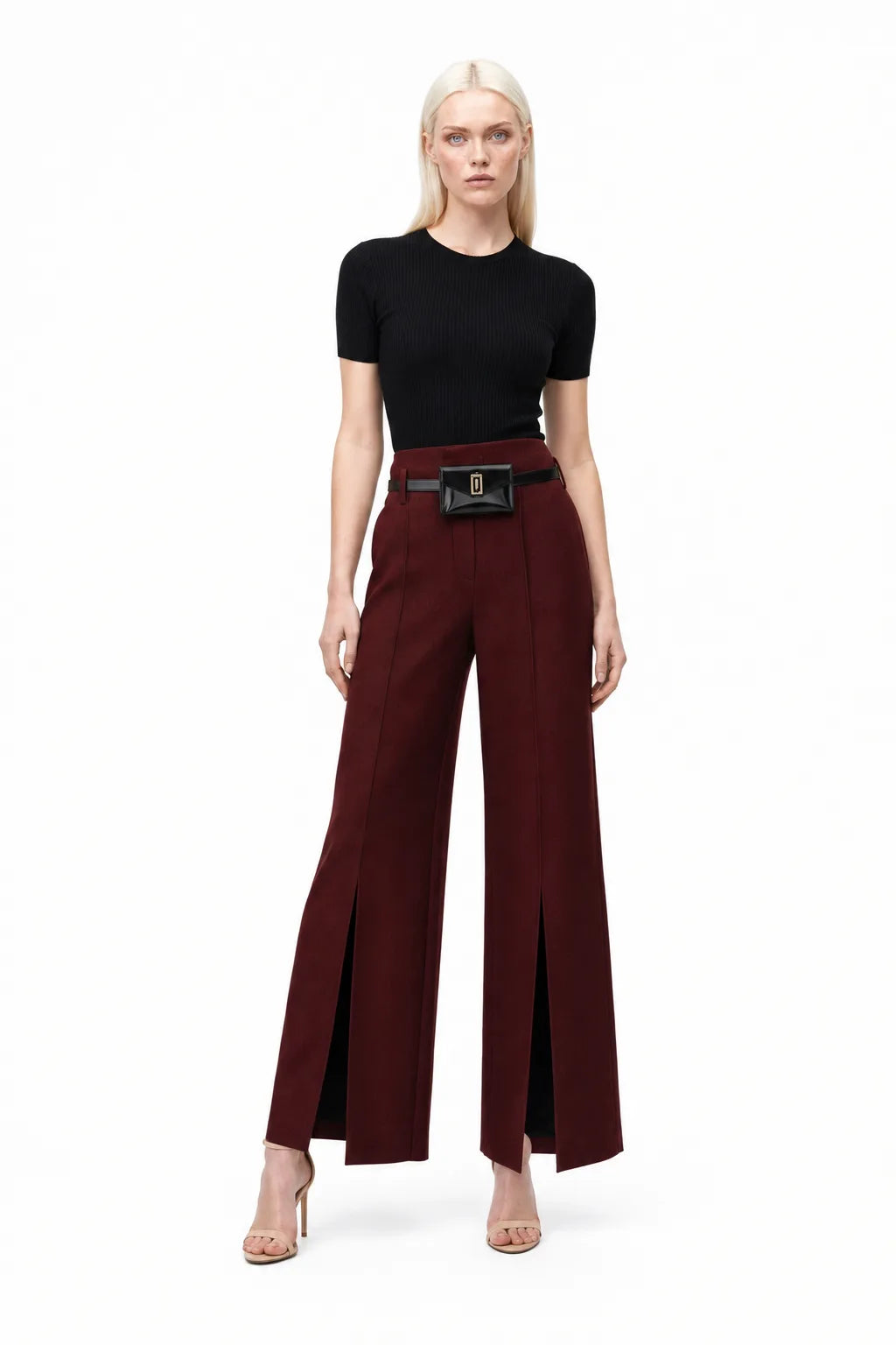 Wine red wide leg trousers with split hem, model in contrapposto stance