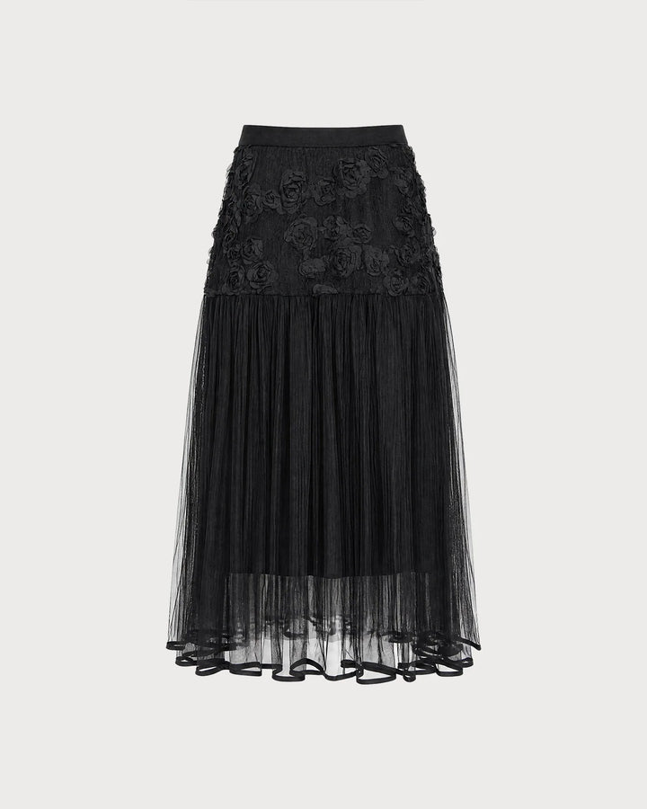 Black rose appliqué midi dress, model in three-quarter turn