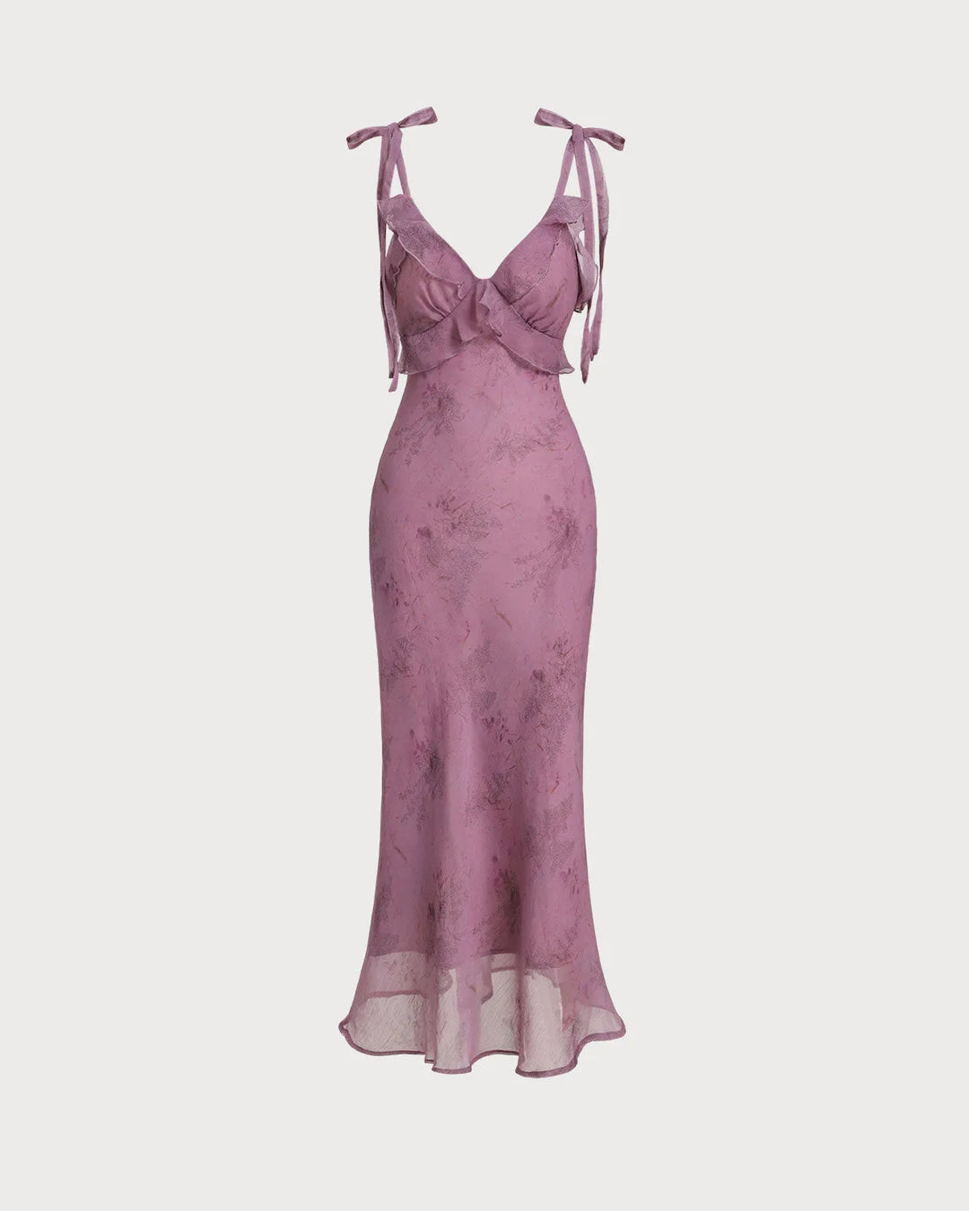 Side view of model wearing a purple ruffle tie strap midi dress