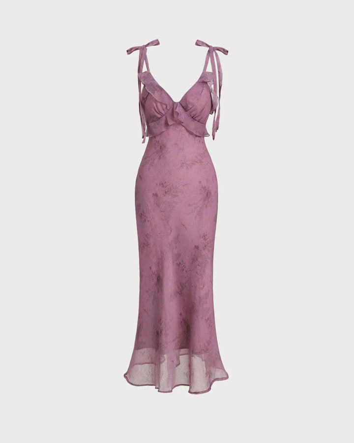 Side view of model wearing a purple ruffle tie strap midi dress