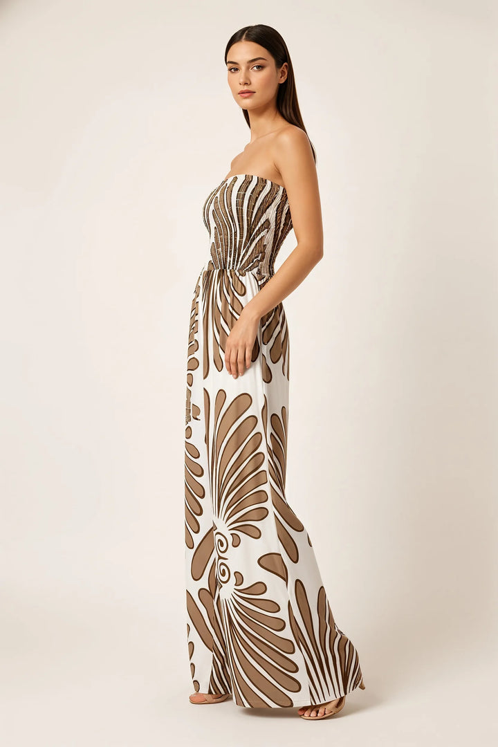 Brown smocked print jumpsuit on model in three-quarter turn