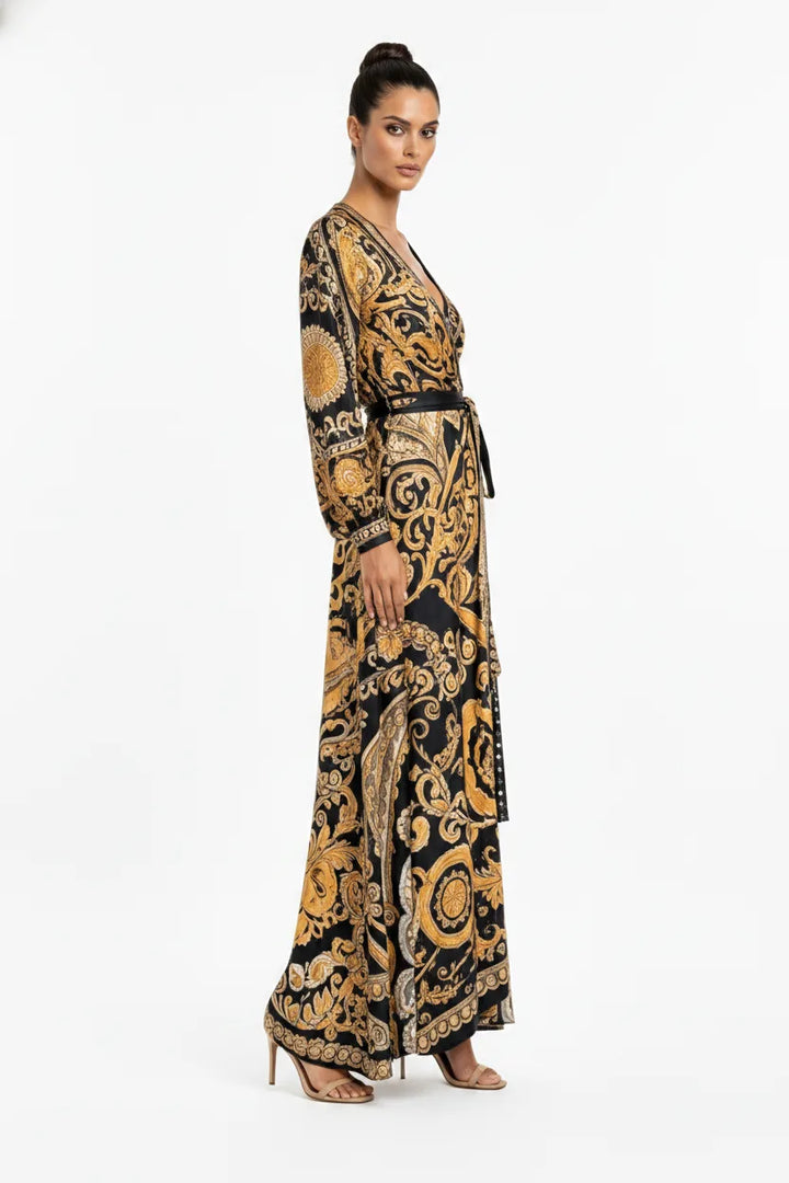 Golden yellow baroque-print wrap maxi dress on model in three-quarter turn