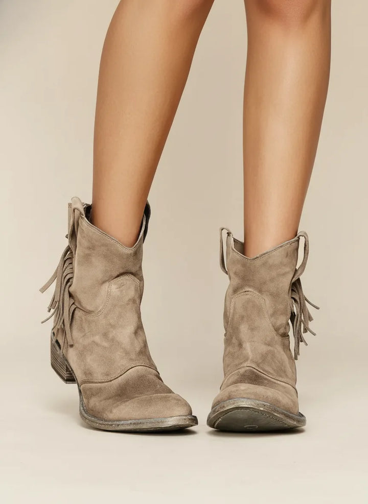Brown fringe western ankle boot, side profile highlighting shaft height and fringe trim