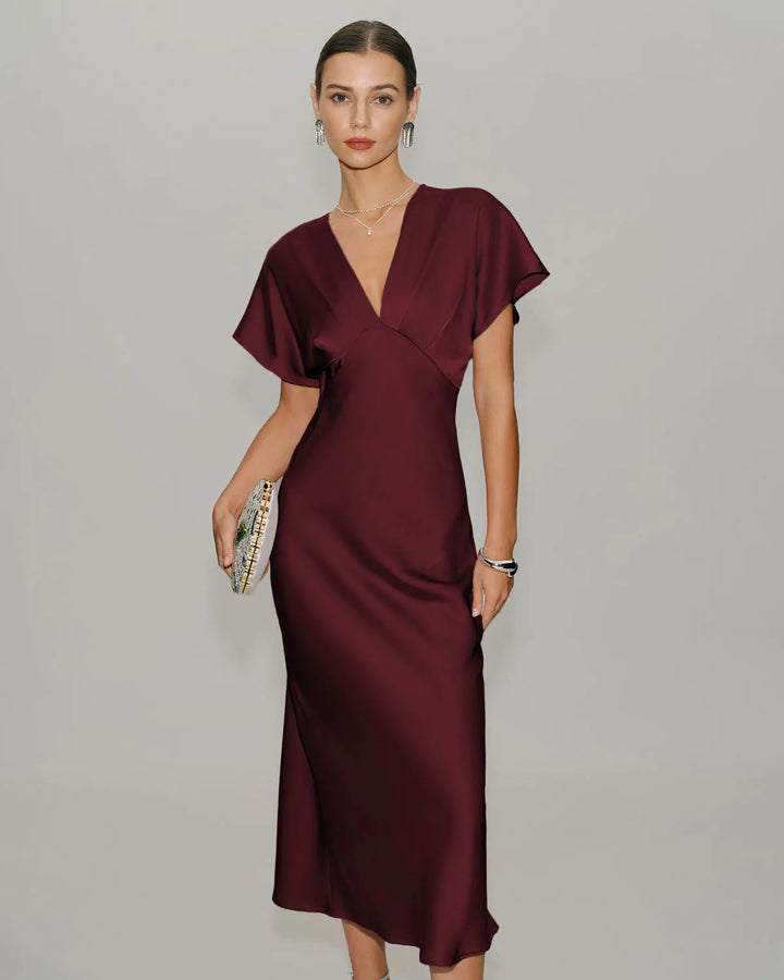 Wine red flutter sleeve midi dress on model facing forward