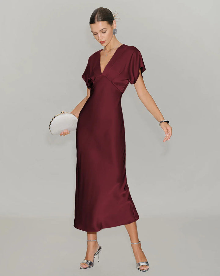 Wine red flutter sleeve midi dress on model from the side