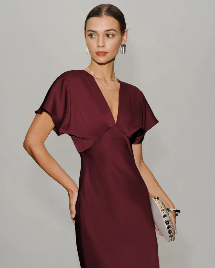 Wine red flutter sleeve midi dress on model in three-quarter turn