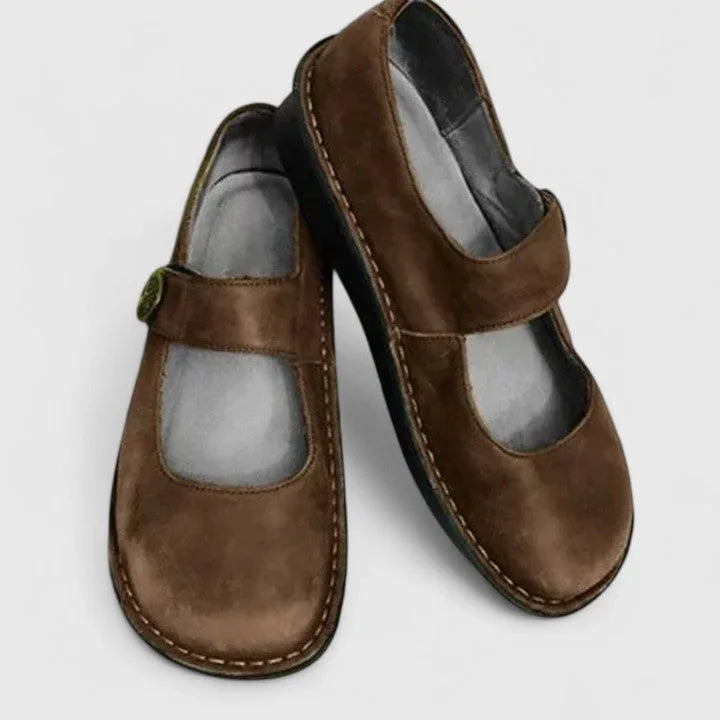 Brown velcro strap mary jane shoe, side profile view