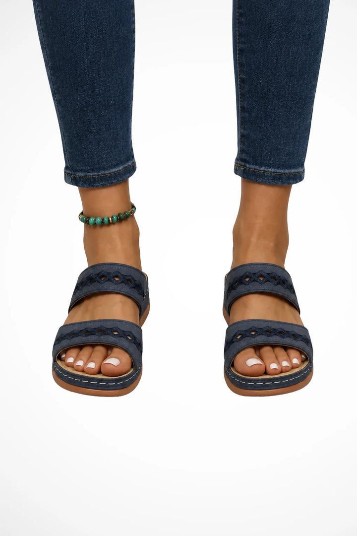 Dark blue cutout two-strap slide sandal, front view