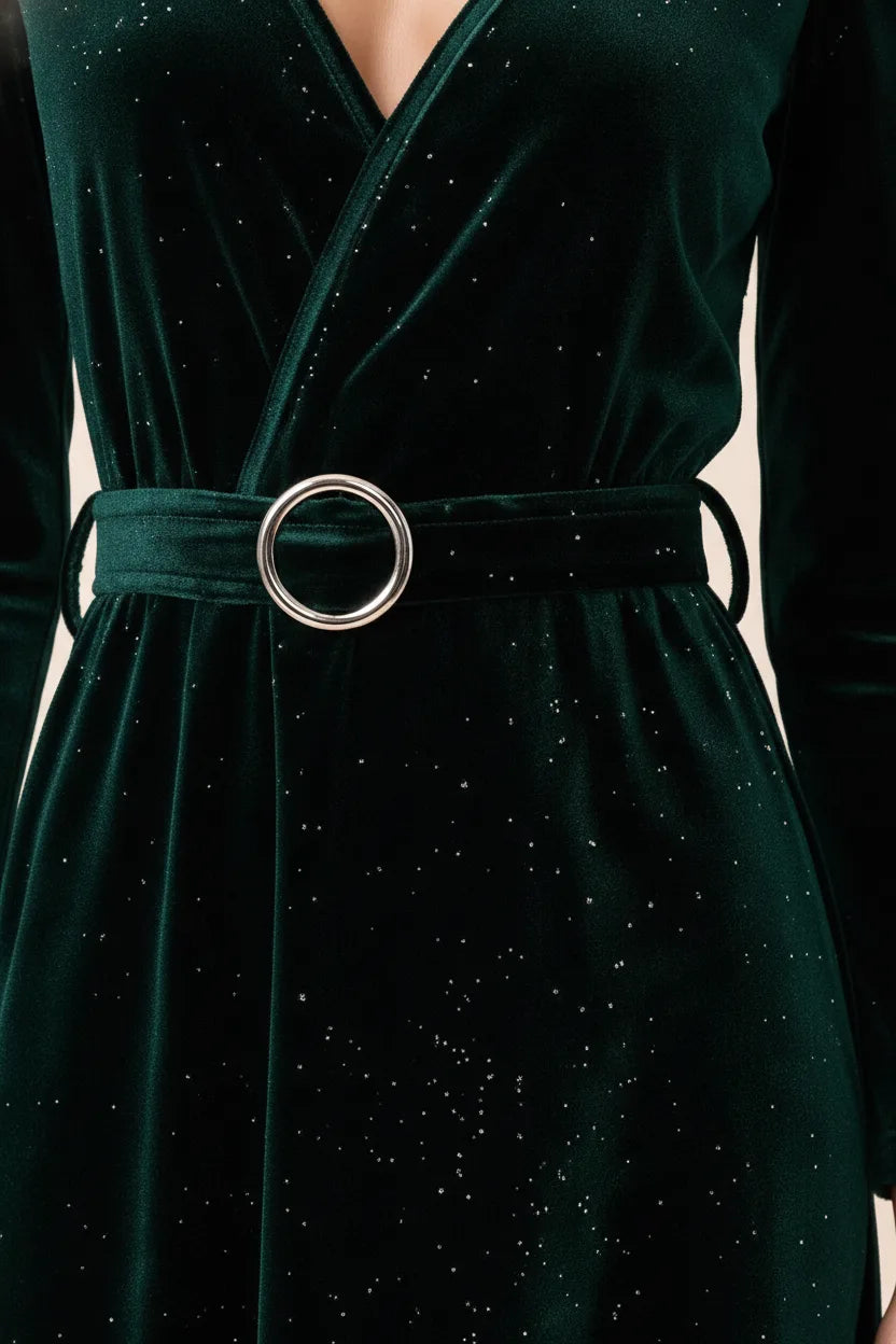 Close-up detail of dark green glitter velvet wrap midi dress fabric and wrap tie