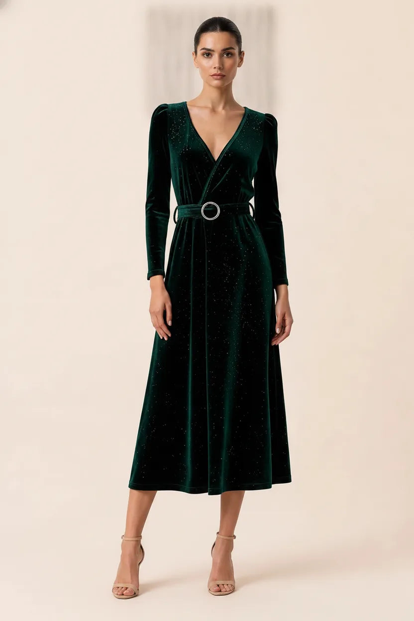 Dark green glitter velvet wrap midi dress displayed outside a storefront