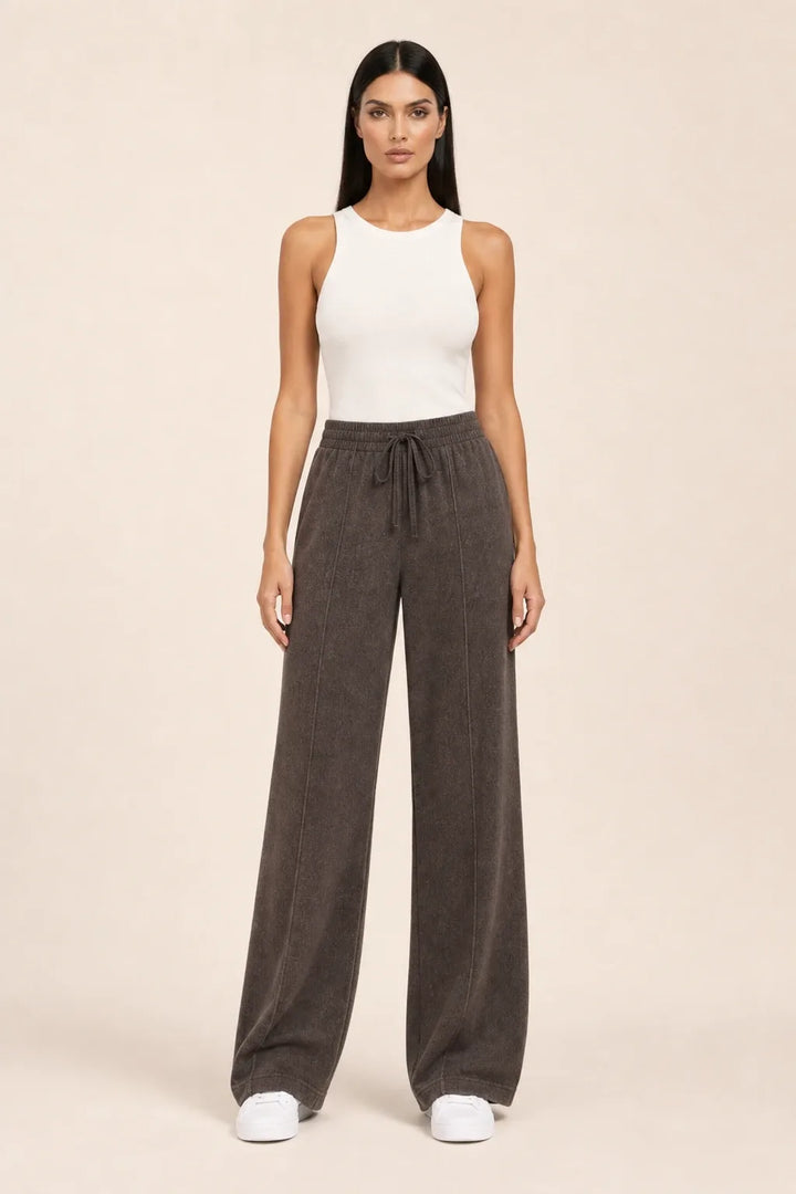 Coffee-toned knit wide-leg pants on a model in a contrapposto stance