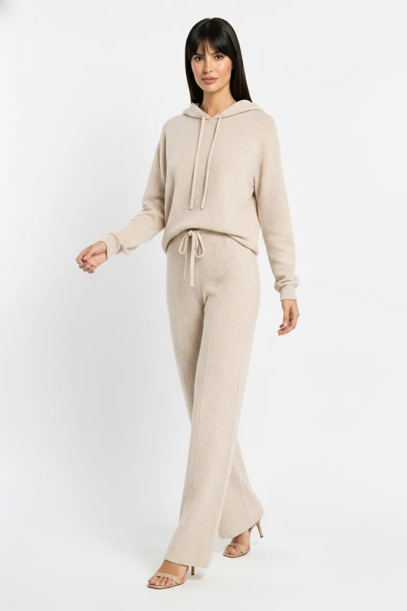 Beige knit wide-leg trousers on a model in natural movement