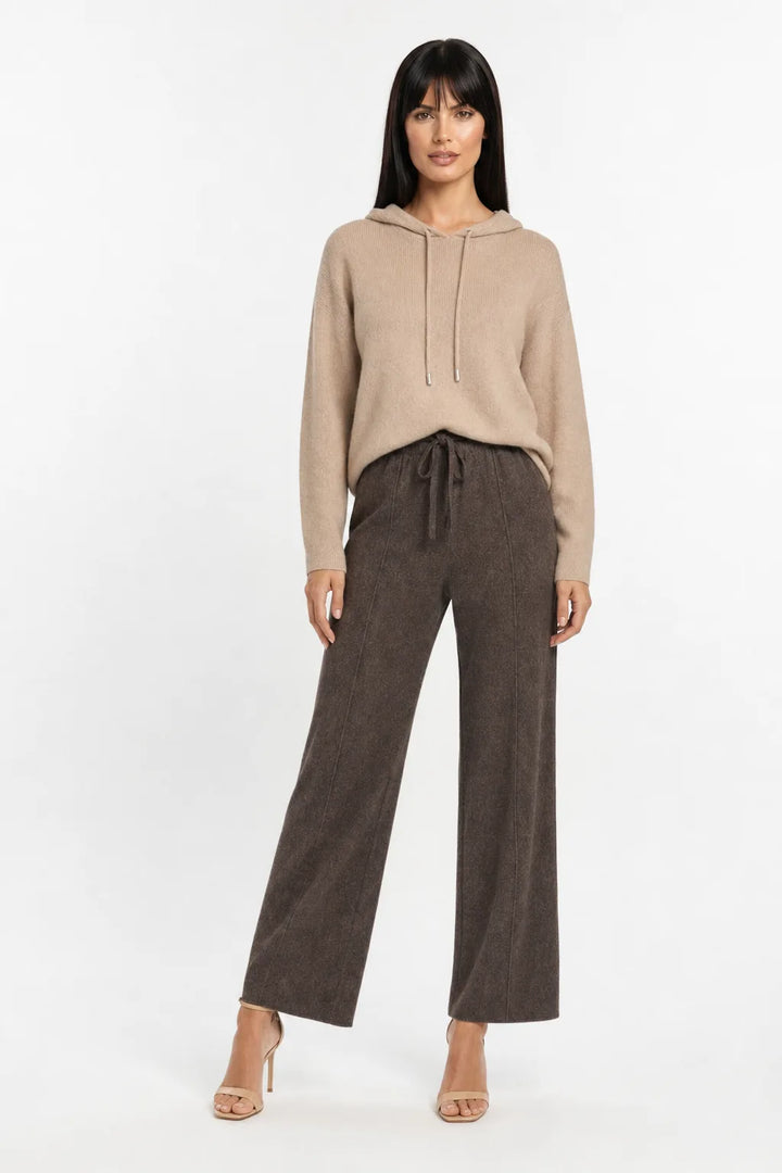 Coffee knit wide-leg trousers on a model in a contrapposto stance