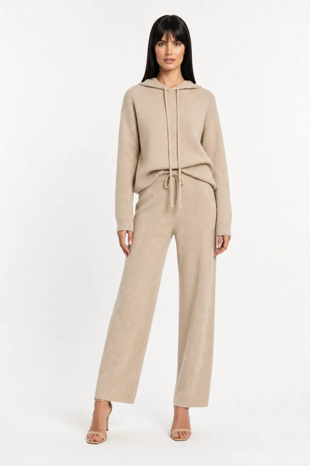 Khaki knit wide-leg trousers on a model in a contrapposto stance