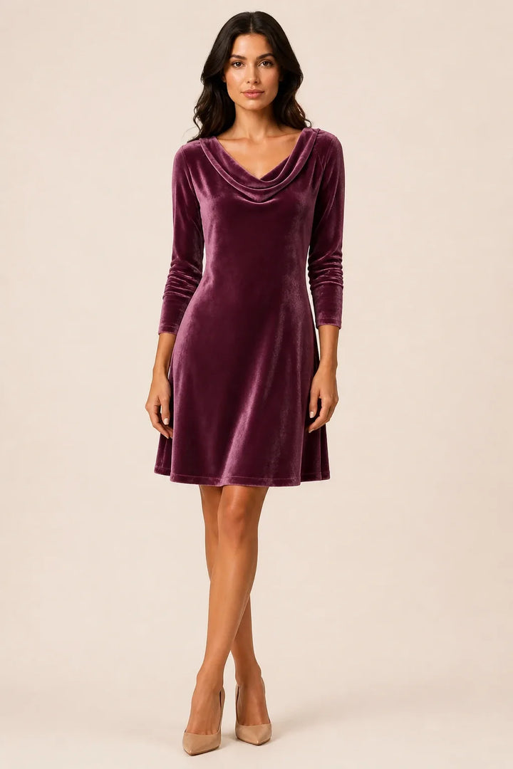 Purple velvet cowl-neck mini dress on a model in a contrapposto stance