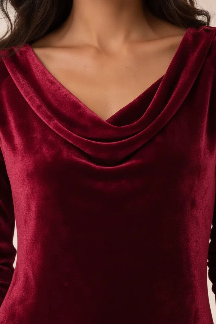 Close-up detail of a red velvet cowl-neck mini dress