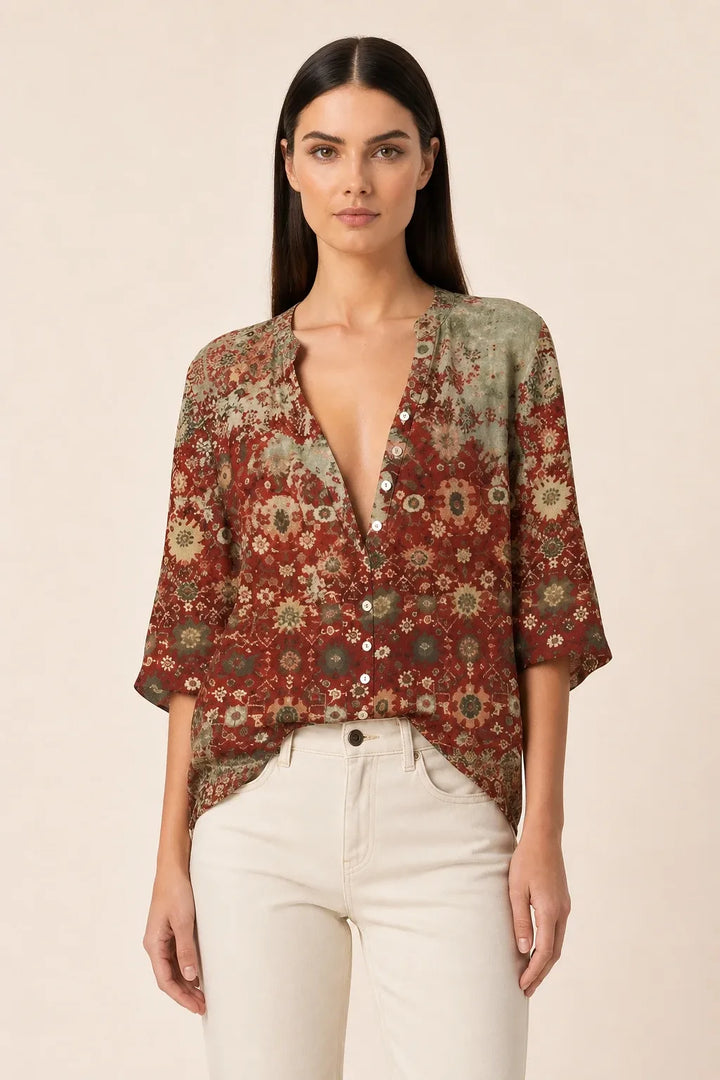 Brown floral blouse with balloon sleeves on a model in a contrapposto stance