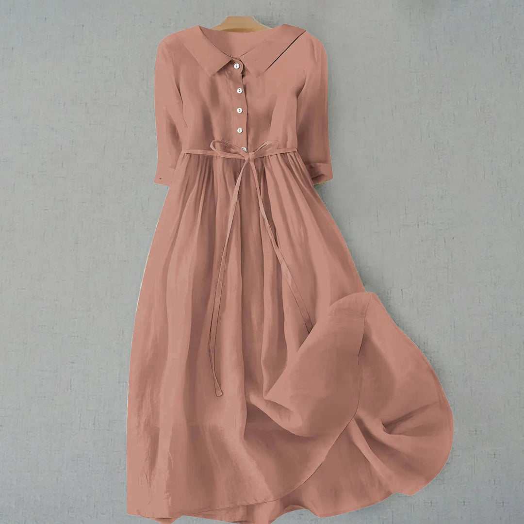 Light brown midi dress with Peter Pan collar on standing model