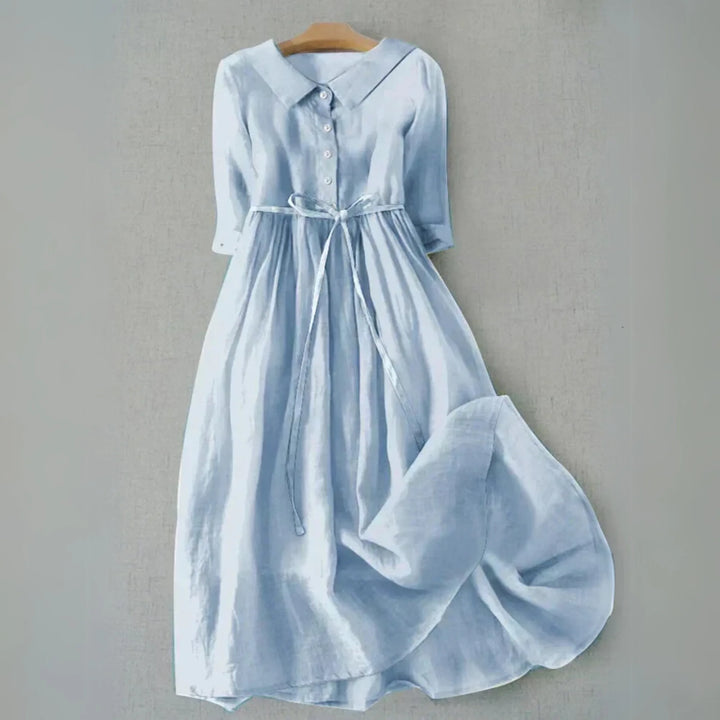 Sky blue Peter Pan collar midi dress, model at three-quarter turn