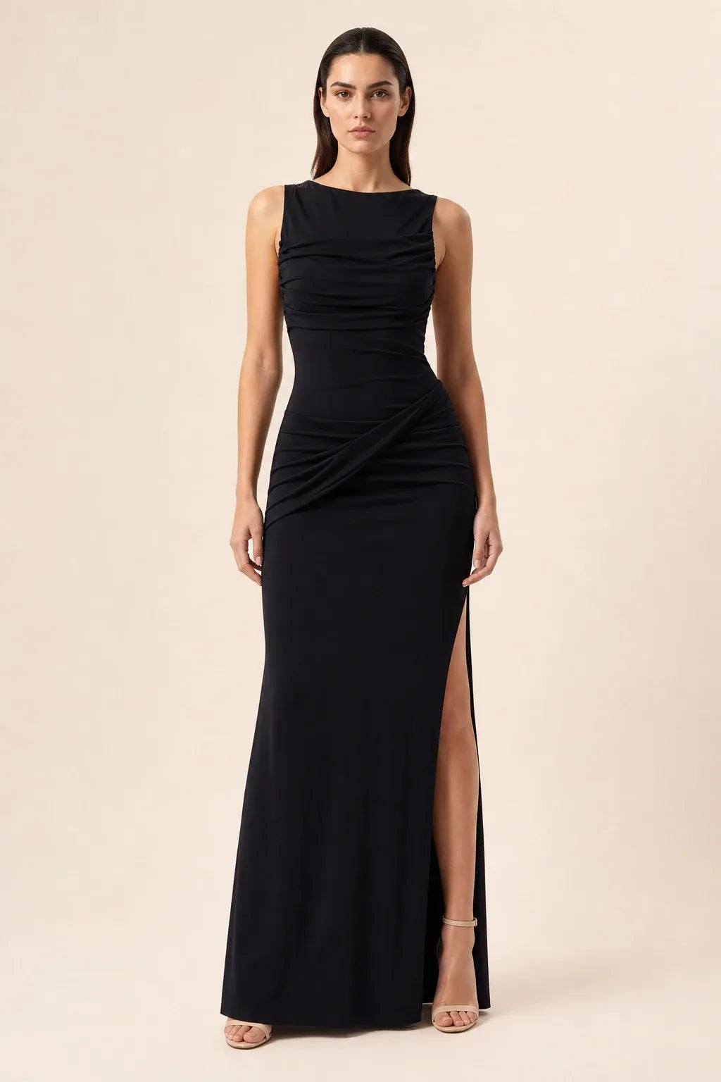 Black ruched open-back gown on model in contrapposto stance