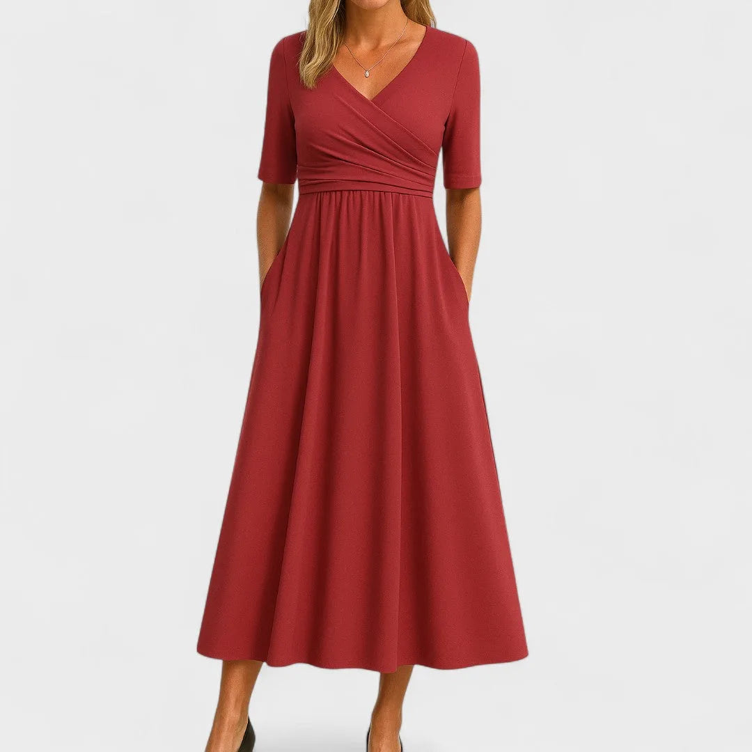 Red wrap midi dress on model, showcasing wrap front and midi-length draped skirt