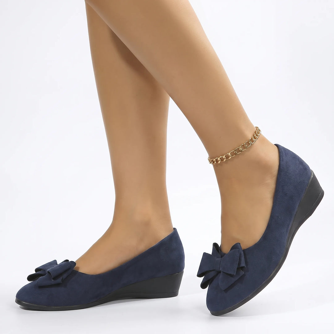Blue ballet flat with bow detail, front view