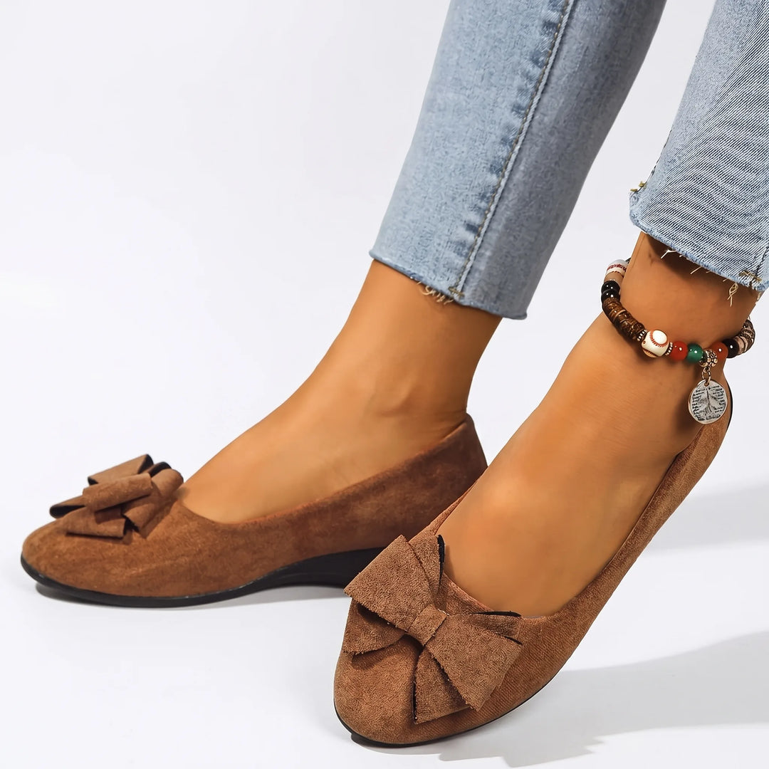 Brown ballet flat with bow detail, front view