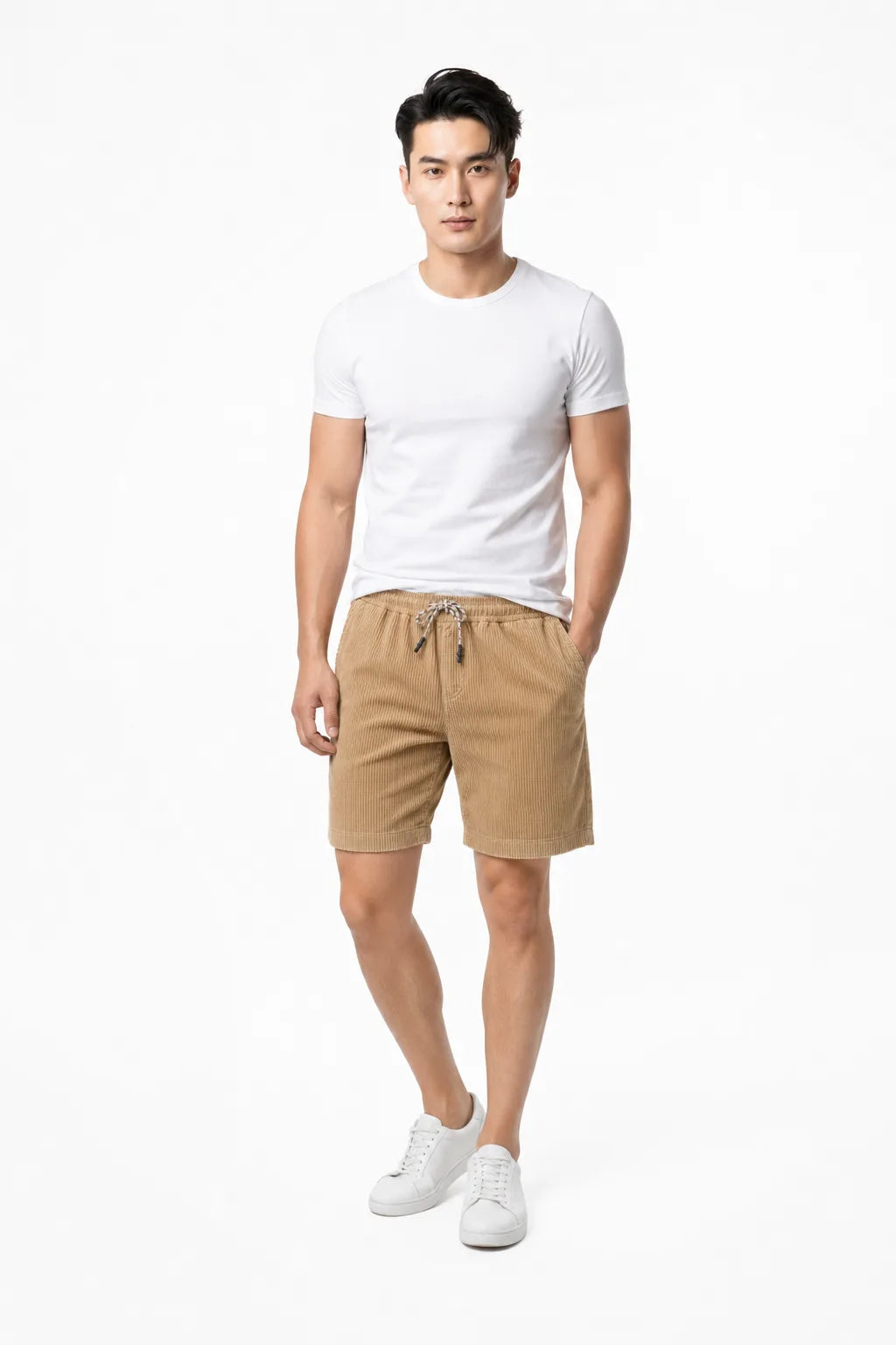Khaki corduroy drawstring shorts on a model in a contrapposto stance