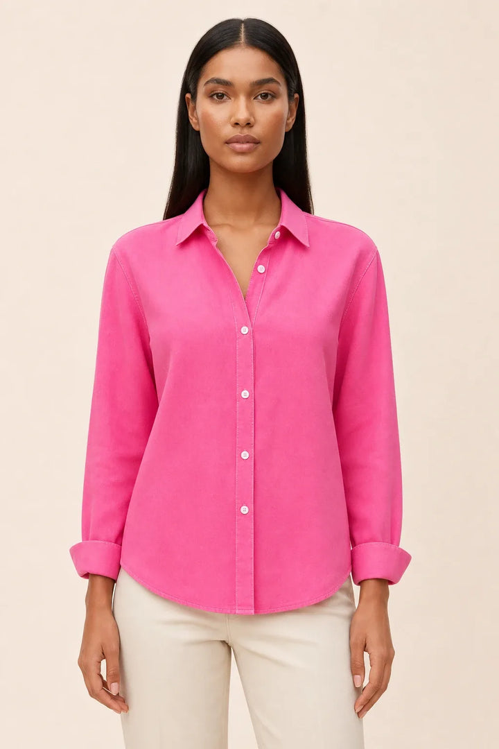 Fuchsia relaxed button-down blouse on a model in a contrapposto stance