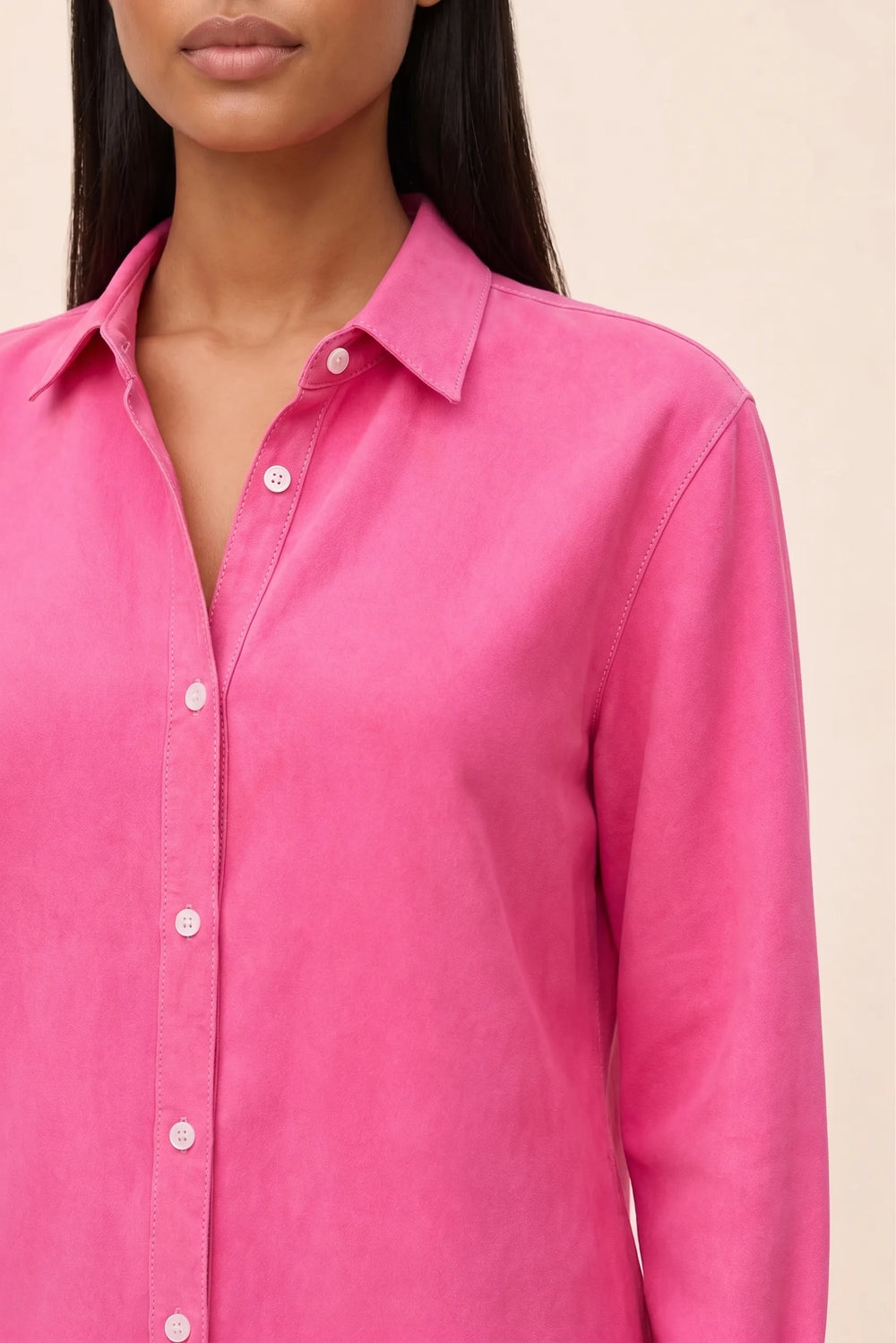 Close-up detail of a fuchsia relaxed button-down blouse