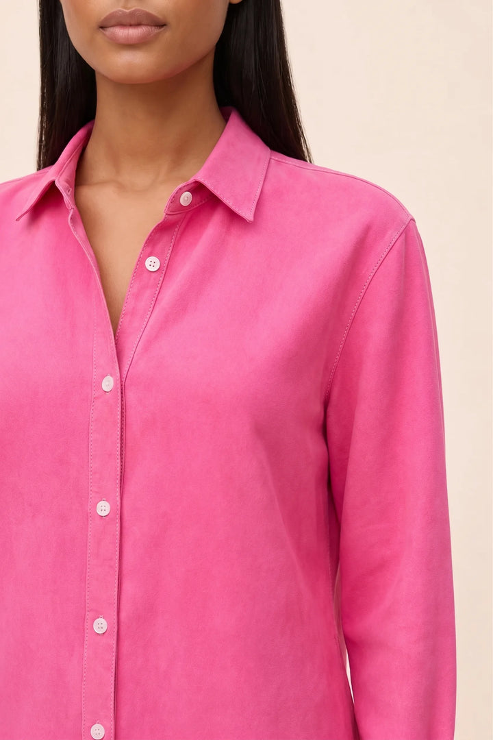 Close-up detail of a fuchsia relaxed button-down blouse